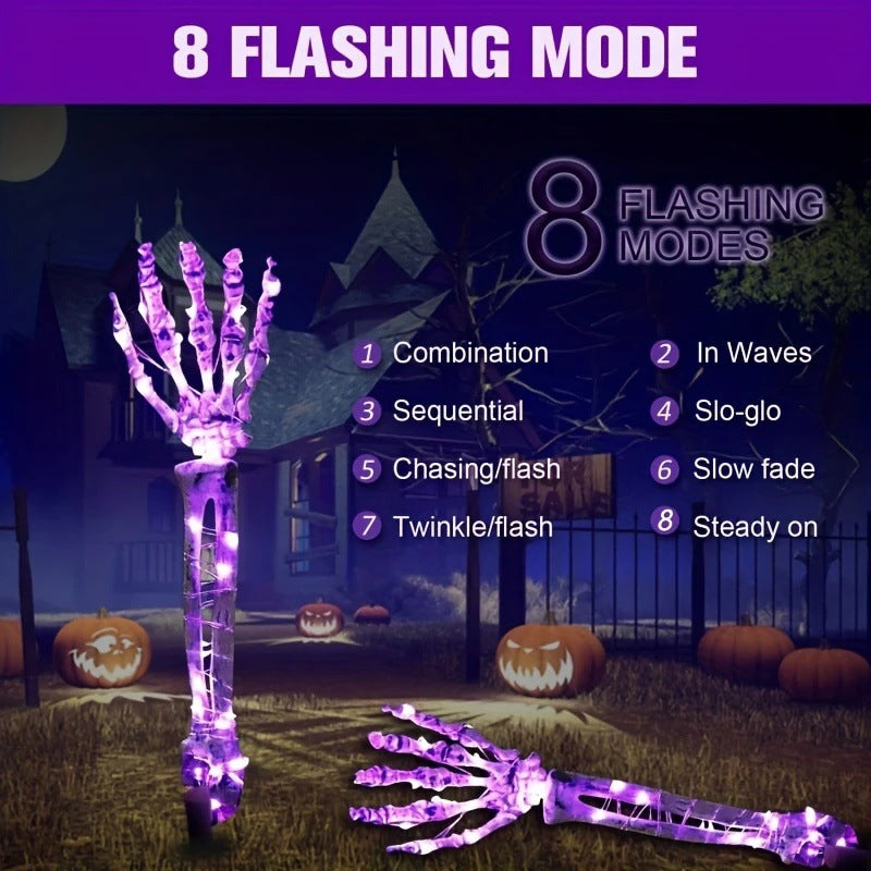 Solar-powered glowing skull arm garden stake light
